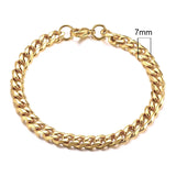 Gold chain bracelet with a measurement label on a white background